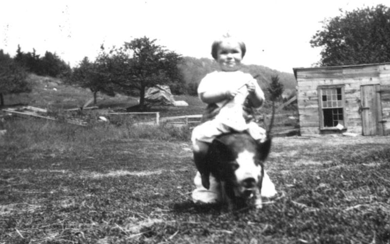 Longtime Waitsfield educator Betty Joslin as a child. She is on her family’s farm riding a pic.