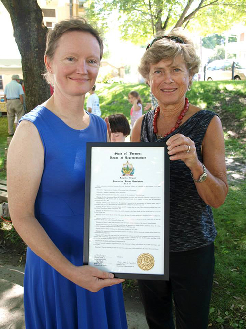 Librarian Joy Worland and Board Chair Jean Joslin with the Resolution for library from the Vermont Legislature