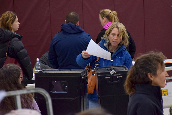 Waitsfield voter Kate Williams casts her ballot at the 2016 Waitsfield Town Meeting. Photo: Jeff Knight
