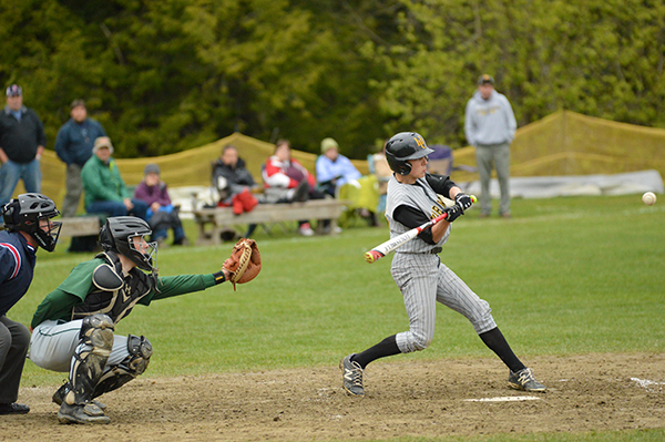 Harwood's Charles Zschau gets a hit during Harwood's 8-3 victory over Montpelier. Photo: Chris Keating
