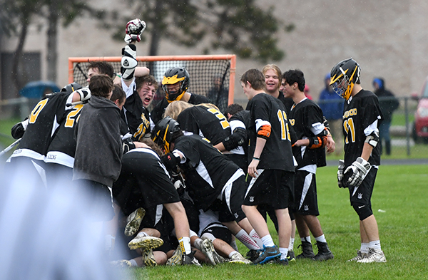 Harwood boys lacross celebrates their 14-8 win over Milton propelling them to the championships in Burlington against rival Stowe. Photo: John Williams