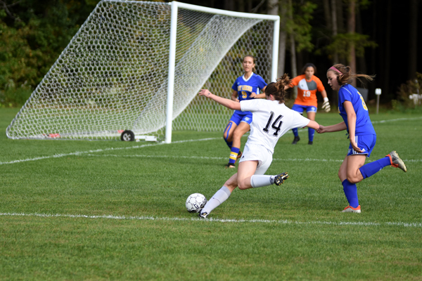 Eleanor Reilly takes a shot during Harwood's win over Lamoille. Photo: Chris Keating