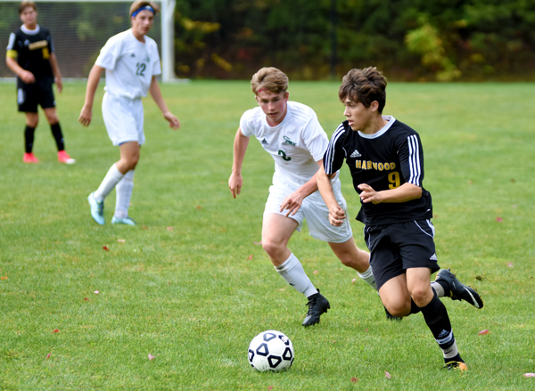 Harwood's Asa Moscowitz dribbles around a GMVS defender in the Highlander's 1-0 win over GMVS on October 7. Photo: Christopher Keating