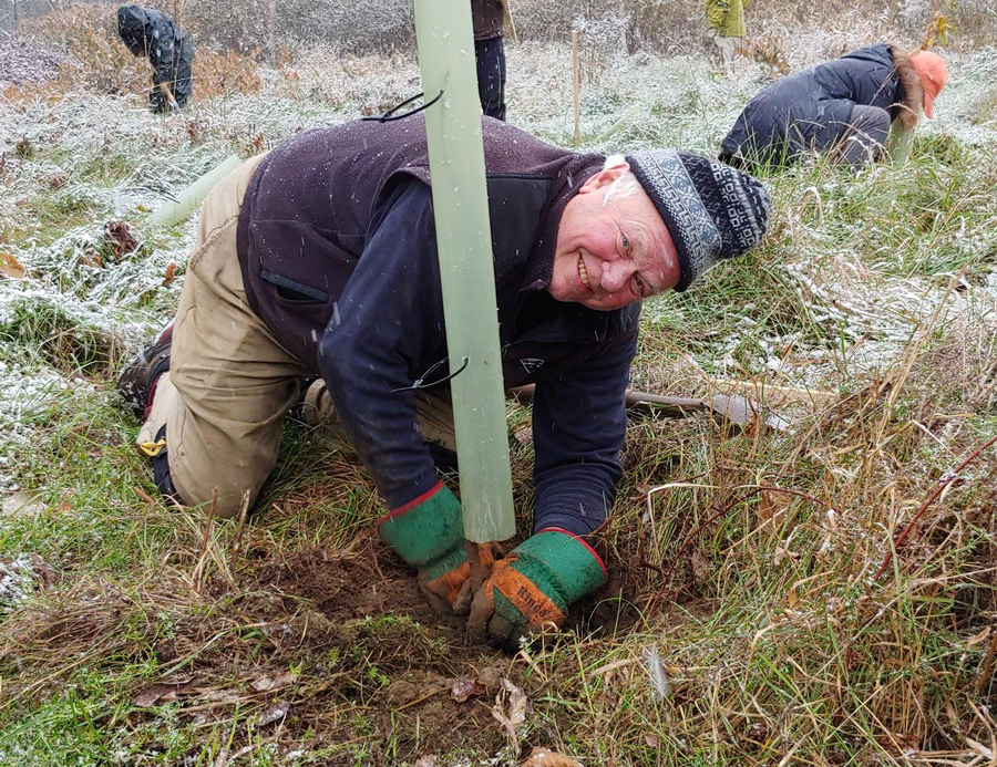 Bob Cook of Waitsfield planting trees as part of a floodplane restoration project. Photo: Corrie Miller
