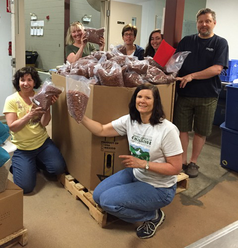 Photo courtesy of Jen Bennett: Volunteers from PAWSitive Pantry at the Vermont Foodbank headquarters in Barre.