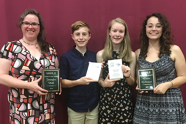 Crossett Brook Middle School students and teachers received awards: left to right, librarian Jen Hill, eighth-grader Adam Porterfield, eighth-grader Maisie Franke, and social studies teacher Grace Gilmour.