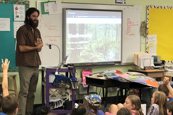 Eric Hagen, UVM grad student and consultant with the Vermont Alliance for Half Earth, speaks to Warren School third- through sixth-graders about biodiversity and the Half Earth Project in preparation for this Thursday’s bioblitz.