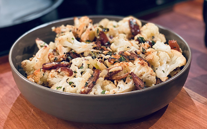 Roasted cauliflower with caramelized dates, almonds, and mint