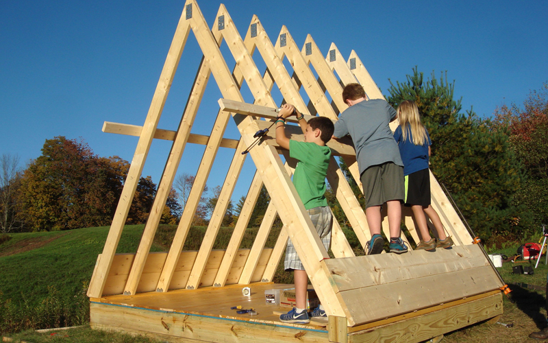 Sculpture School students building an A-frame structure at Pony Farm in Moretown in 2016. Photo by Eddie Merma